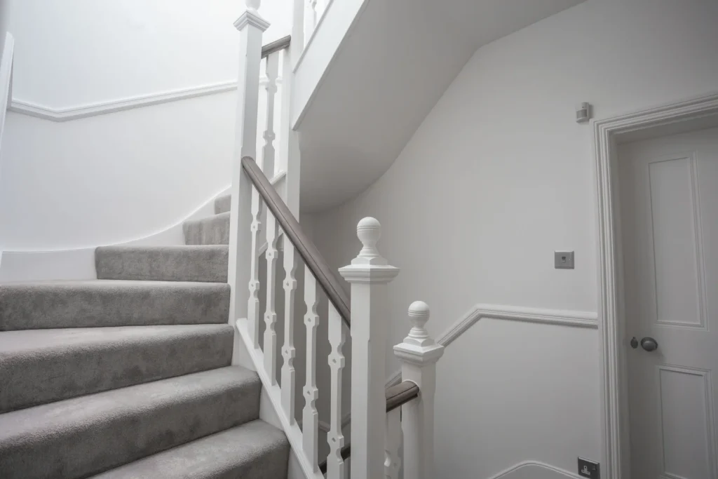Loft conversion staircase with handrails on both sides