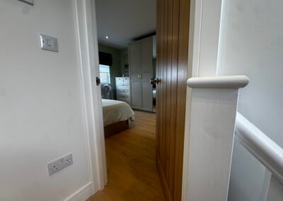 Master bedroom in a Windsor loft conversion with large rear windows