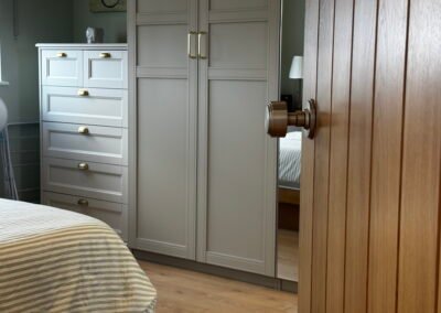 Master bedroom in a Windsor loft conversion with large rear windows