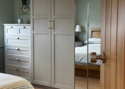 Master bedroom in a Windsor loft conversion with large rear windows