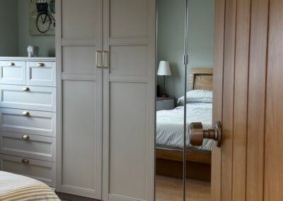 Master bedroom in a Windsor loft conversion with large rear windows