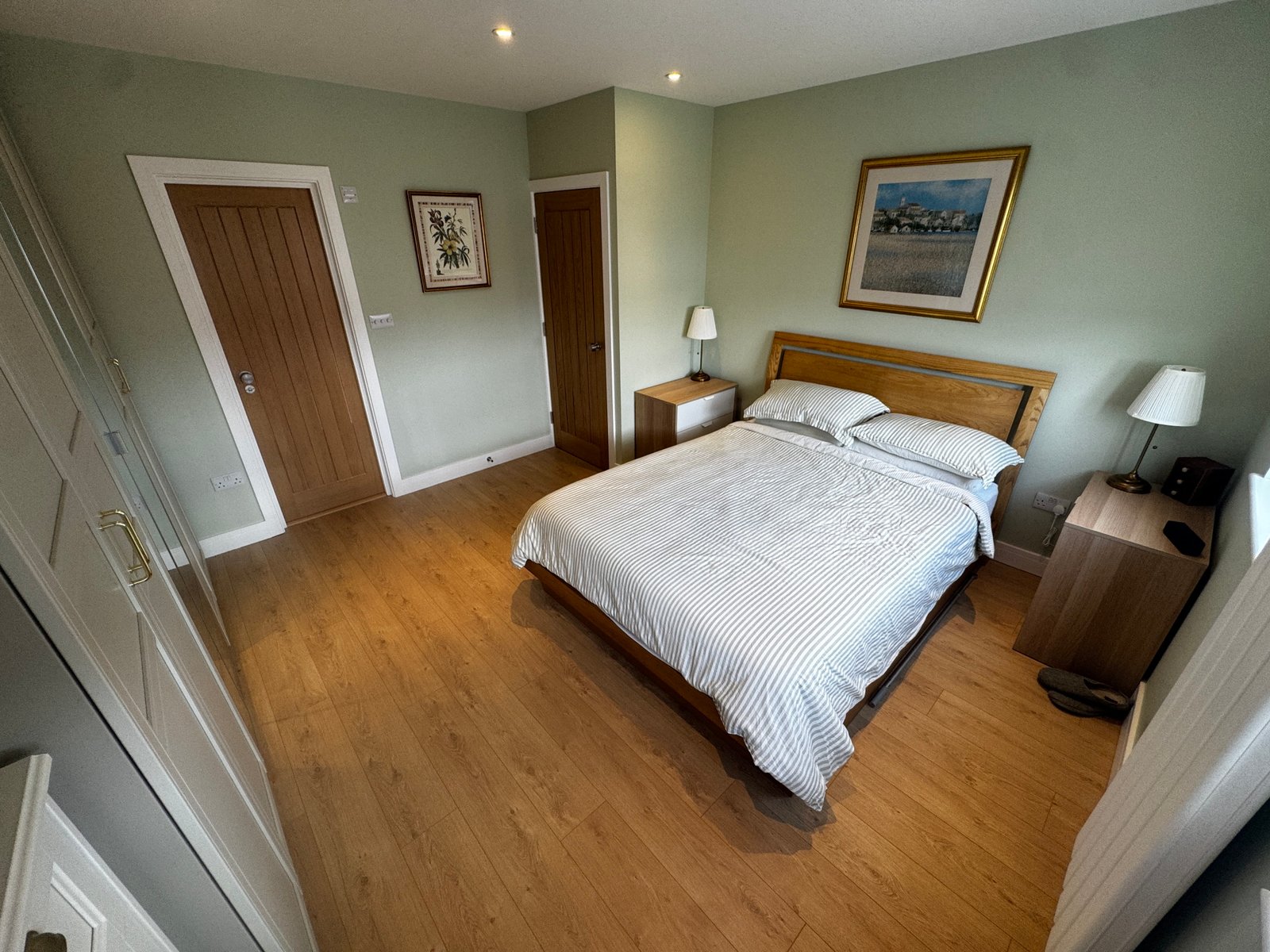 Master bedroom in a Windsor loft conversion with large rear windows