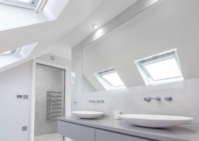 Loft Conversion in Edgware, London: modern bathroom roof windows