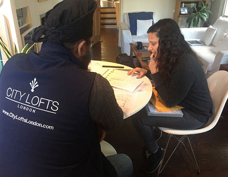 Image of City Lofts team talking with one of our clients